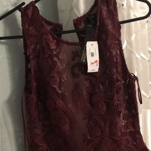 Brand new dress color red wine and knee length.